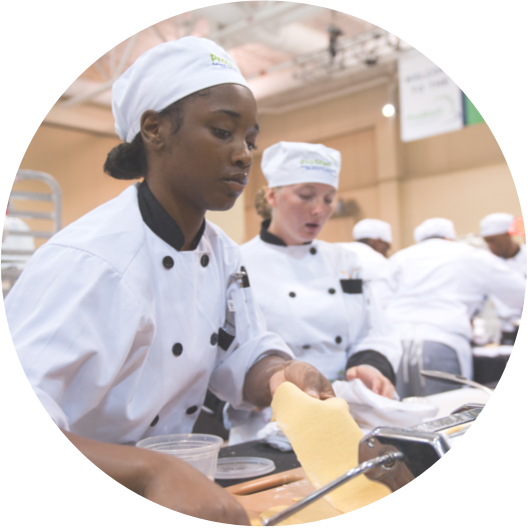 Young people participating in culinary training